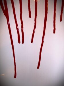 Blood dripping down a wall
