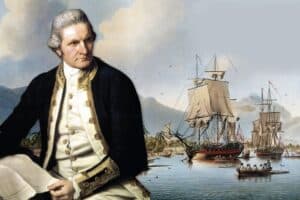 Captain James Cook sitting in front of his ship