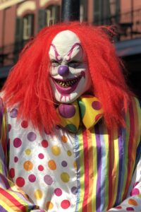 Man dressed as scary clown ghost