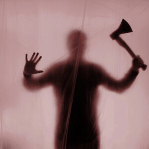 Ian Brady behind screen with axe