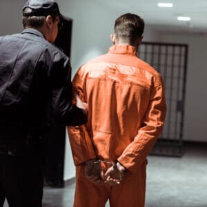 guard walking prisoner to execution
