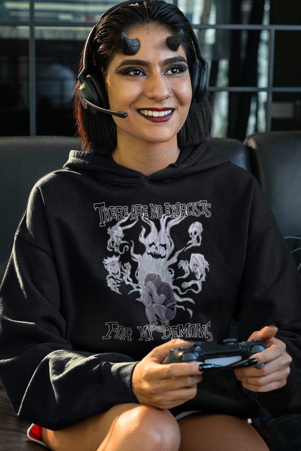 demon woman playing video games in hoodie with demons on it