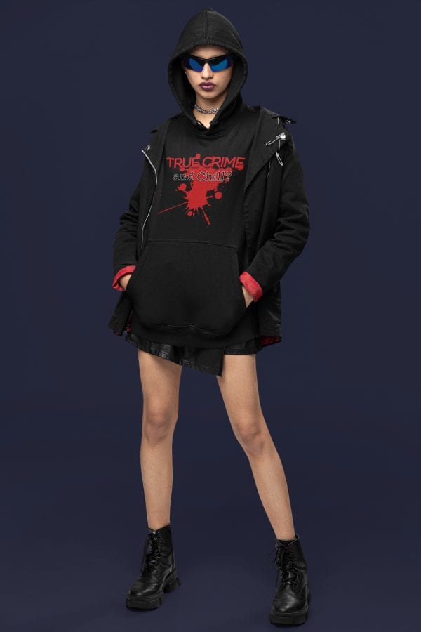 goth person wearing true crime hoodie and stylish jacket