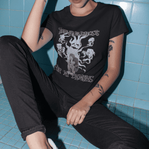 punk woman sitting in bathroom and wearing black demon shirt