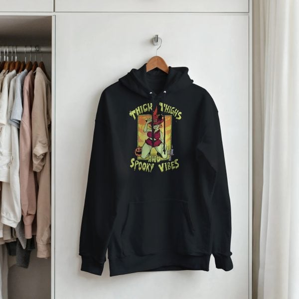 spooky season hoodie hanging in closet