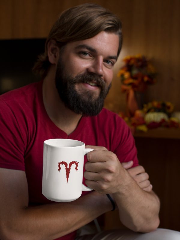 grunge man holding aries symbol mug