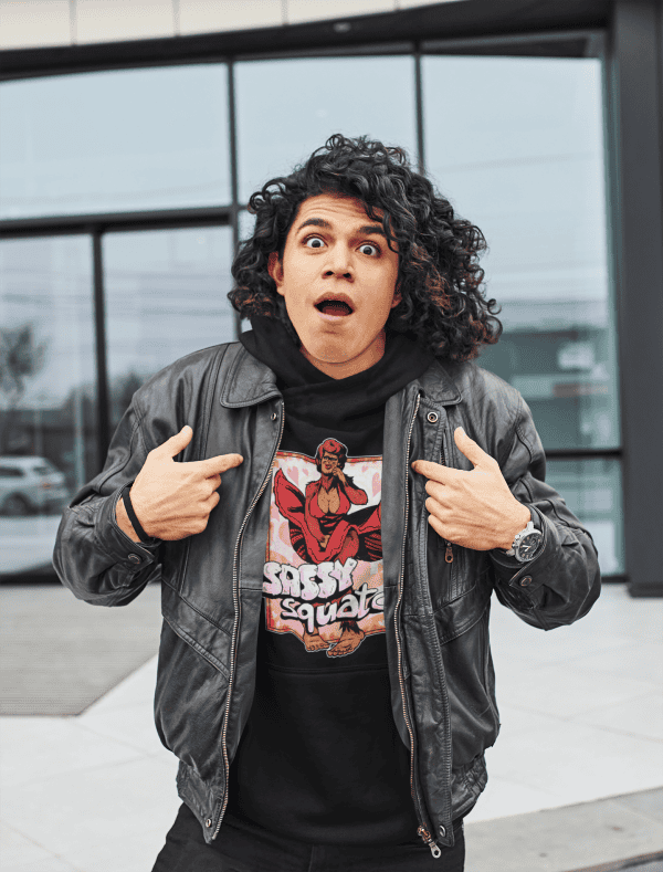 Skater man pointing towards SASSYsquatch bigfoot hoodie featuring bigfoot in a red dress