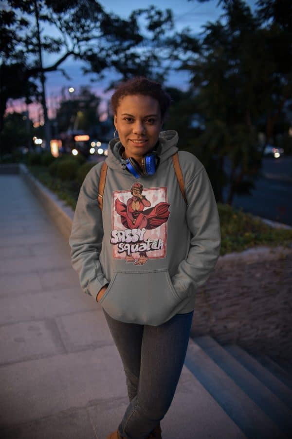Girl dressed in streetwear and wearing a gray bigfoot hoodie