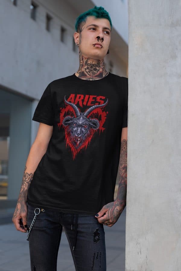 tattooed punk leaning against wall and wearing dark zodiac collection aries horoscope t shirt