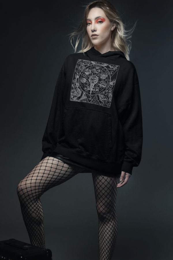 punk chick in fishnets and wearing azonth mandala hoodie for witches and goths