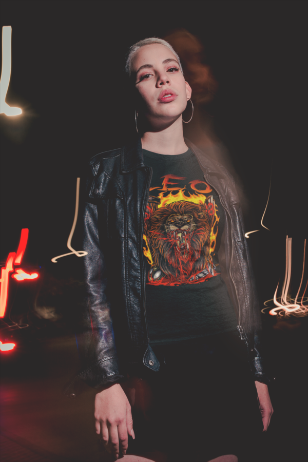 alternative woman in leather jacket and leo sign shirt from the dark zodiac collection