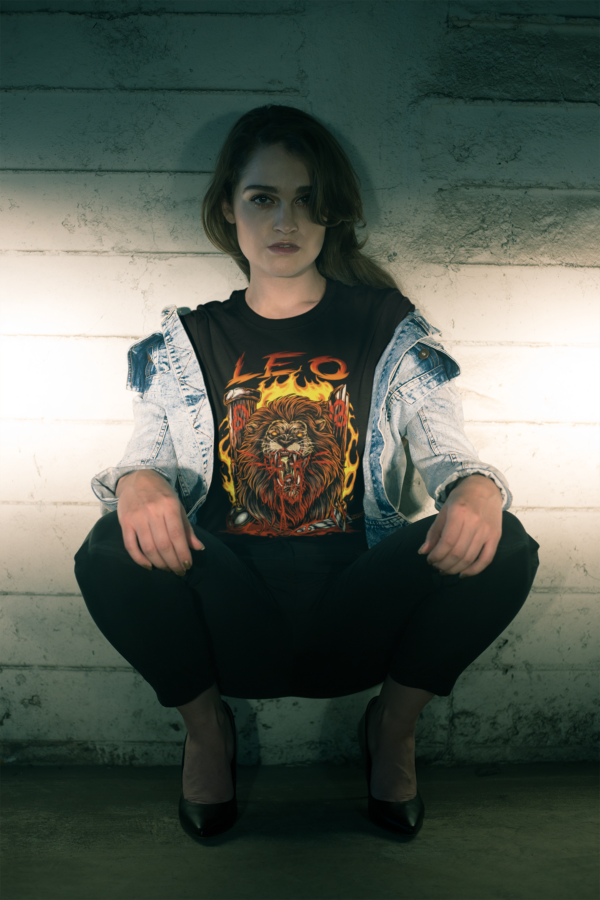 grunge style woman wearing horror art style leo astrology sign t-shirt
