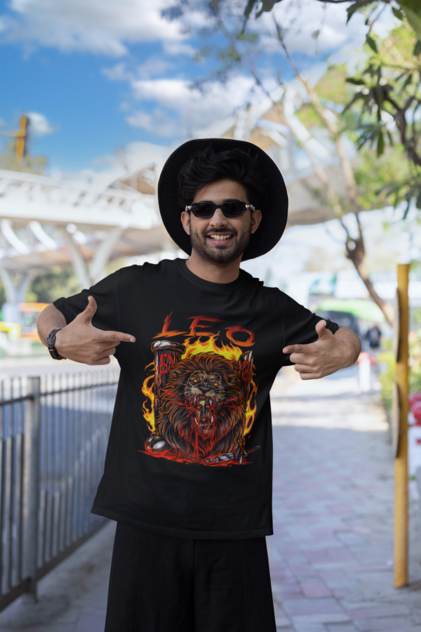 queer man in all black rocking the horror style leo zodiac tee for goths