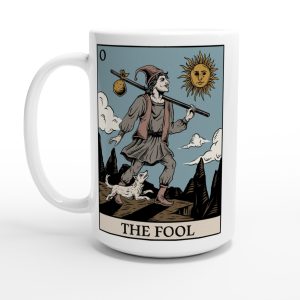 close up of 15 oz white mug with the fool tarot card design