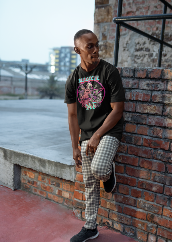 alternative streetwear model wearing black magical mf t shirt and leaning against brick wall