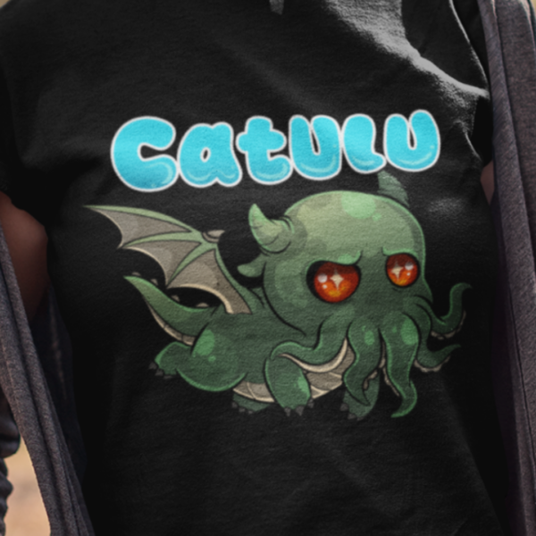 close up of alternative style kawaii cthulhu design on black t-shirt