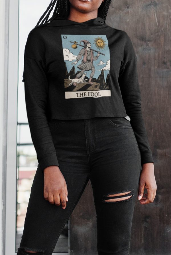 alternative model posing in goth outfit with the fool card design crop top hoodie