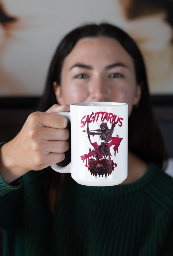 alt woman with nose piercing holding sagittarius dark zodiac mug up to camera