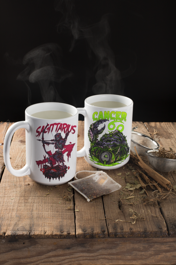 close up of sagittarius sign zodiac mug and cancer sign mug on rough wooden bench