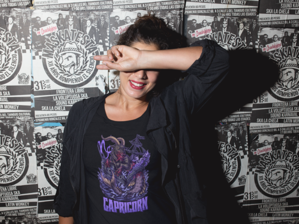 alt style model in black t shirt featuring horror art style capricorn sign graphic