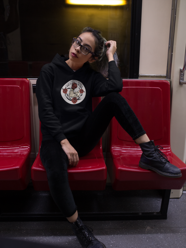 alternative fashion model in all black wearing communist hoodie with hammer and sickle design