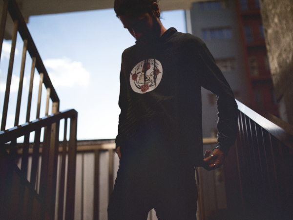 grunge person in black hoodie with funny communist design print