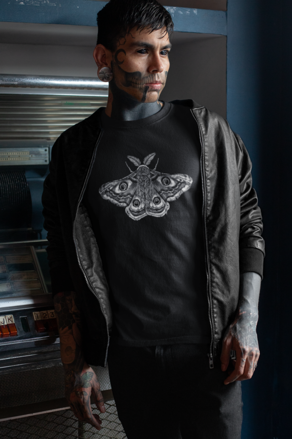 tattooed goth man wearing black t shirt with moth design print