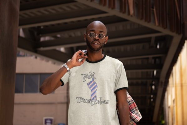 grunge style model in retro shirt top with middle finger and fuck transphobes slogan
